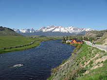 The Salmon River and Sawtooth Mountains along state highway 75 looking west towards Stanley