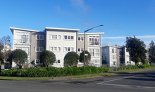 Coloured image of two apartment buildings