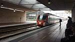 A train at Airport station in 2014