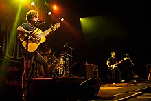 The John Butler Trio (left to right: John Butler on guitar, Nicky Bomba on drums, Byron Luiters on bass) performing in Toronto c. 2012