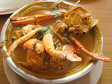 Photo of cooked crab in bowl of soup