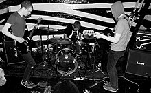 Adebisi Shank in 2009 (from left to right; Larry Kaye, Michael Roe, Vincent McCreith).