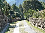 Road flanked by stone walls