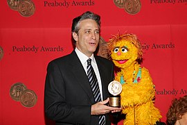 Jon Stewart and Kami (The HIV Positive Muppet) (8227462942).jpg