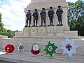 Wreaths laid before the five bronze statues in 2009