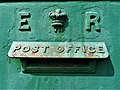 Edward VII post box in Ireland, painted green.