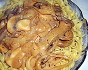 Beef Stroganoff atop pasta