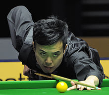 photo of Marco Fu playing a shot