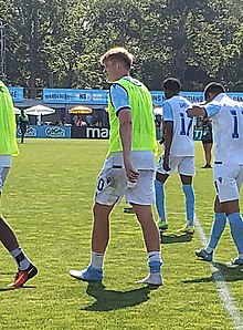 Warschewski walking on the pitch after a match