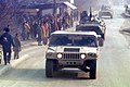 Two Russian BTR-80 APCs following an American Humvee in Zvornik