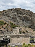 Thumbnail for File:Piers of the demolished bridge and a cow on the top of the rock.jpg