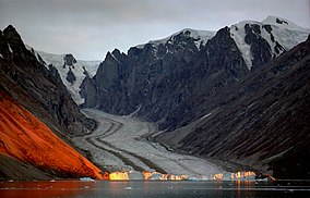 Franz Josef Fjord, glacier. The orange colour is caused by reflected sunlight.