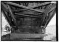 Detail of Southeast abutment with view of double Burr Arch rings bearing on abutment and lower truss details.