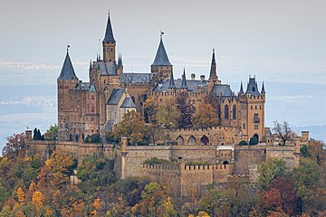 A castle atop a mountain, a very usual position to defend it from a higher position.