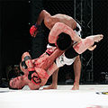 Image 4MMA fighter attempts a Triangle-Armbar submission on his opponent. (from Mixed martial arts)