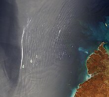 wave clouds observed over the ocean, seen from a satellite