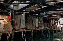 Shack built out of metal and wood under a different bridge