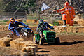 Image 13 Lawn mower racing Photo credit: Fir0002 Two racers cross the finish line of the 250cc class at the 2007 Swifts Creek lawn mower races. In this motorsport, competitors race modified lawn mowers, usually of the ride-on or self-propelled variety. Original mower engines are retained but blades are removed for safety. Lawn mowers have also been used in kart racing, a different sport. More selected pictures