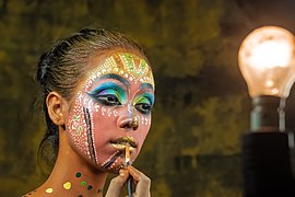 Traditional folk face painting by TAPAS KUMAR HALDER.