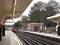 Ealing Common station, southbound Piccadilly line train departs (September 2006)