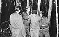 Raul Castro (second from left) is shown blindfolding a man to be shot by firing squad. Oriente Province, Cuba, circa 1958.