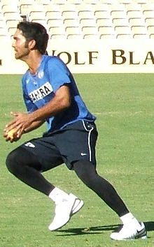 Karthik, poised to run with a ball in his hand
