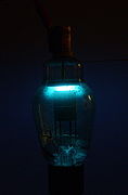 Westinghouse 866A mercury vapor half-wave rectifier tube. Glowing with 5mA in the dark (long exposure)