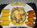 Image 16Plantains and "Bobolo" (made from cassava) served with Ndolè (meat and shrimp) (from Cameroon)