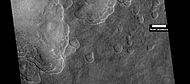 Scalloped ground, as seen by HiRISE under HiWish program. A study published in Icarus found that the landforms of scalloped topography can be made by the subsurface loss of water ice by sublimation under current Martian climate conditions. Their model predicts similar shapes when the ground has large amounts of pure ice, up to many tens of meters in depth.[19]
