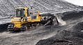 Bulldozer Komatsu D85 PX with semi-U tilt doze pushing coal on Power Station