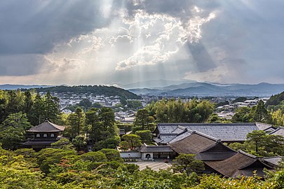 Sunlight through clouds and view of Ginkaku-ji Temple from above, Kyoto, Japan