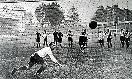 A successful penalty kick, seen from the back of the net