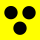 Drei schwarze Punkte auf gelbem Grund