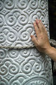 Pillar with upside-down motif. A visitor rubs it for good luck. (Inside of Yōmeimon.)