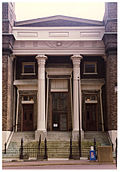 Photograph of the front steps, doors, and façade of Old First Presbyterian Church, showing Egyptian revival details.