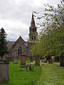 A 2013 view, with the Church of St John the Baptist in the background