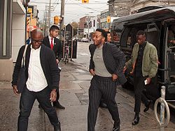 Jenkins, Holland and Sanders exiting a limousine van