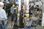 Krakatau subcritical experiment being lowered into the floor of the tunnel of the U1a Complex at the Nevada Test Site (2006). The cables extending from the hole will carry data from the experiment to recording instruments.