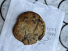 Photograph of a cookie on a branded wrapper