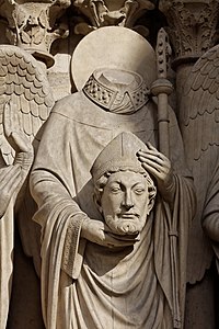 The martyr Saint Denis, holding his head, over the Portal of the Virgin