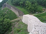 Fortress walls in a forest on a hill