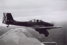 A plane in flight, photographed from another plane