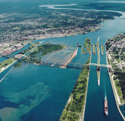 Aerial view of the St. Marys River; Whitefish Island is just to the left of the rapids.