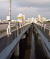 Taipei Bridge in 2008 The eastbound motorcycle/bicycle/pedestrian bridge is to the right and the main automobile bridge is to the left