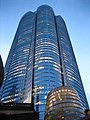 Partially lit Mori Tower from a low view