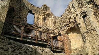 The gatehouse was slighted by detonating gunpowder. 19th-century renovation work by Anthony Salvin is denoted by brick.[10]