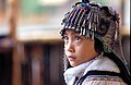 An ethnic Hani girl with the typical headgear for children