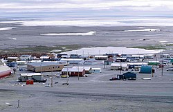 Resolute in August 1997. Visible on the left is a long school building (brown).