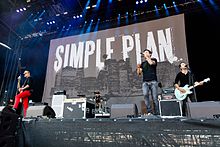 (L–R) David Desrosiers, Chuck Comeau, Pierre Bouvier, and Sébastien Lefebvre performing in 2015