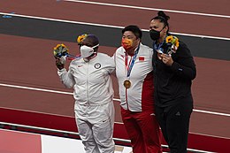 Raven Saunders, Gong Lijiao, and Valerie Adams in 2021.